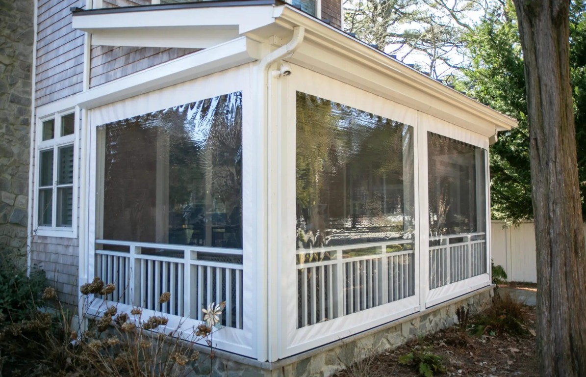 Sunroom conversion with decorative railing details